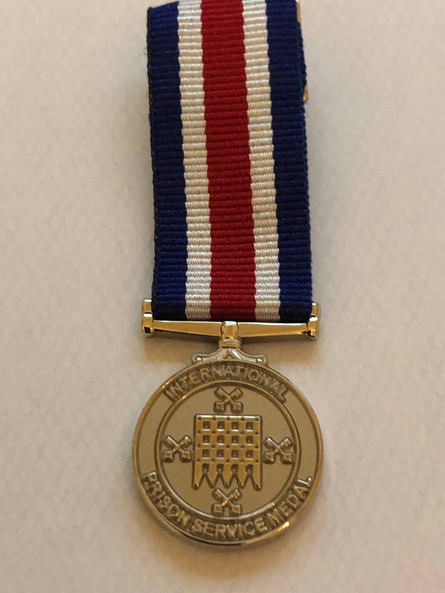 International Prison Service Medal with red navy and white striped ribbon